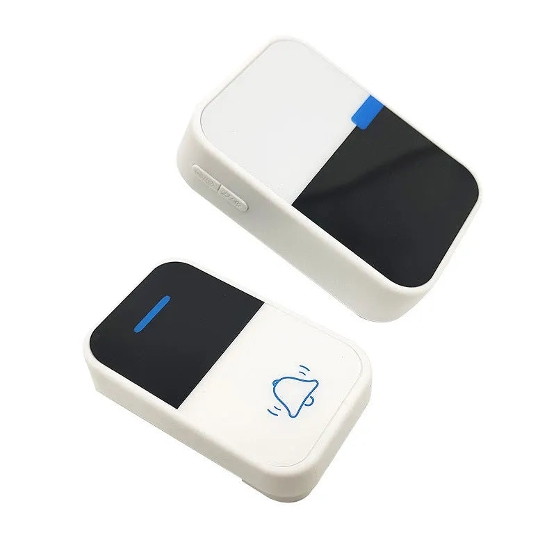 White plastic wireless doorbell receiver and self-generating button on a white background.