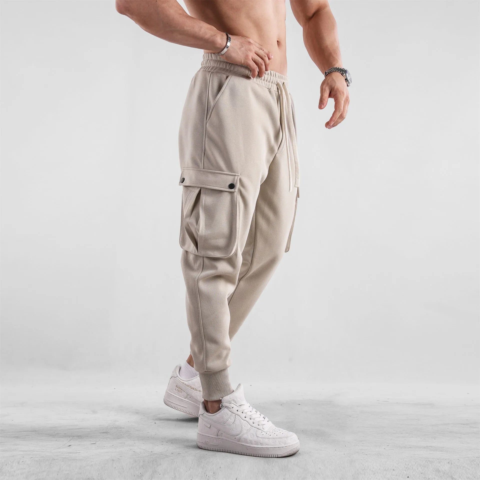 Men's loose cotton trousers with ankle tie fastening and multiple pockets in six colour options