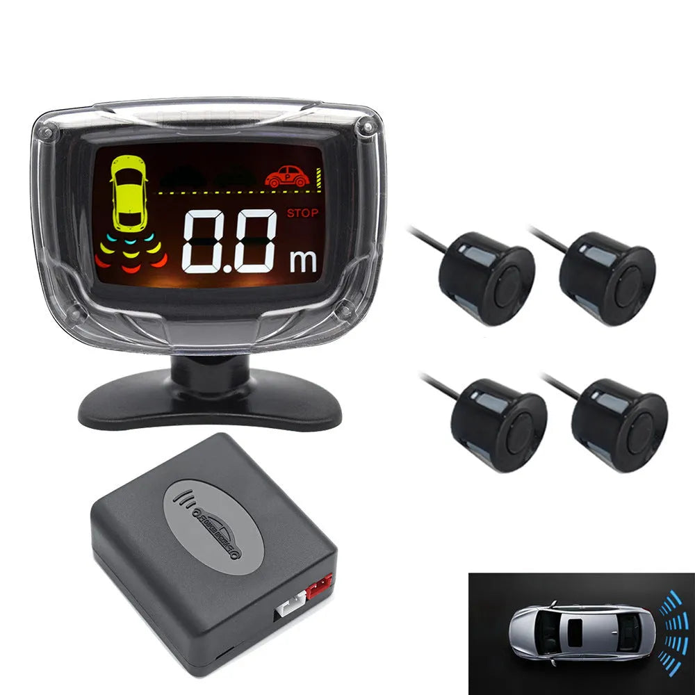 Black wireless reversing sensor kit with digital display, four round probes, power cable, and installation tools.