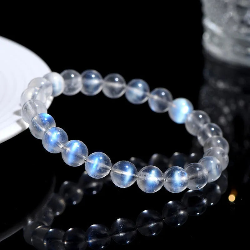 Natural cream blue moonlight crystal bracelet with polished surfaces and simple unisex design