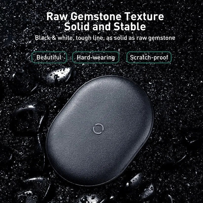 Baseus rough-textured 15W wireless charging pad for mobile phones in black on a desk.