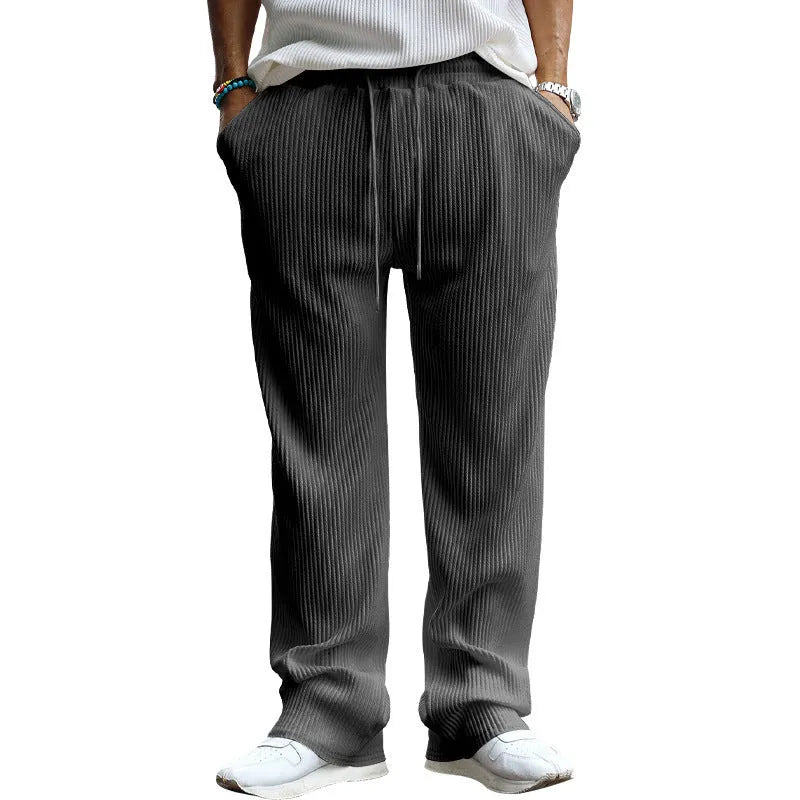 Men's straight-leg loose casual trousers in khaki colour showing high waist and relaxed fit