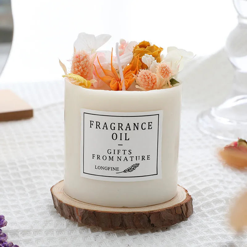 Glass jar scented candle with dried flower decoration, available in multiple fragrance options
