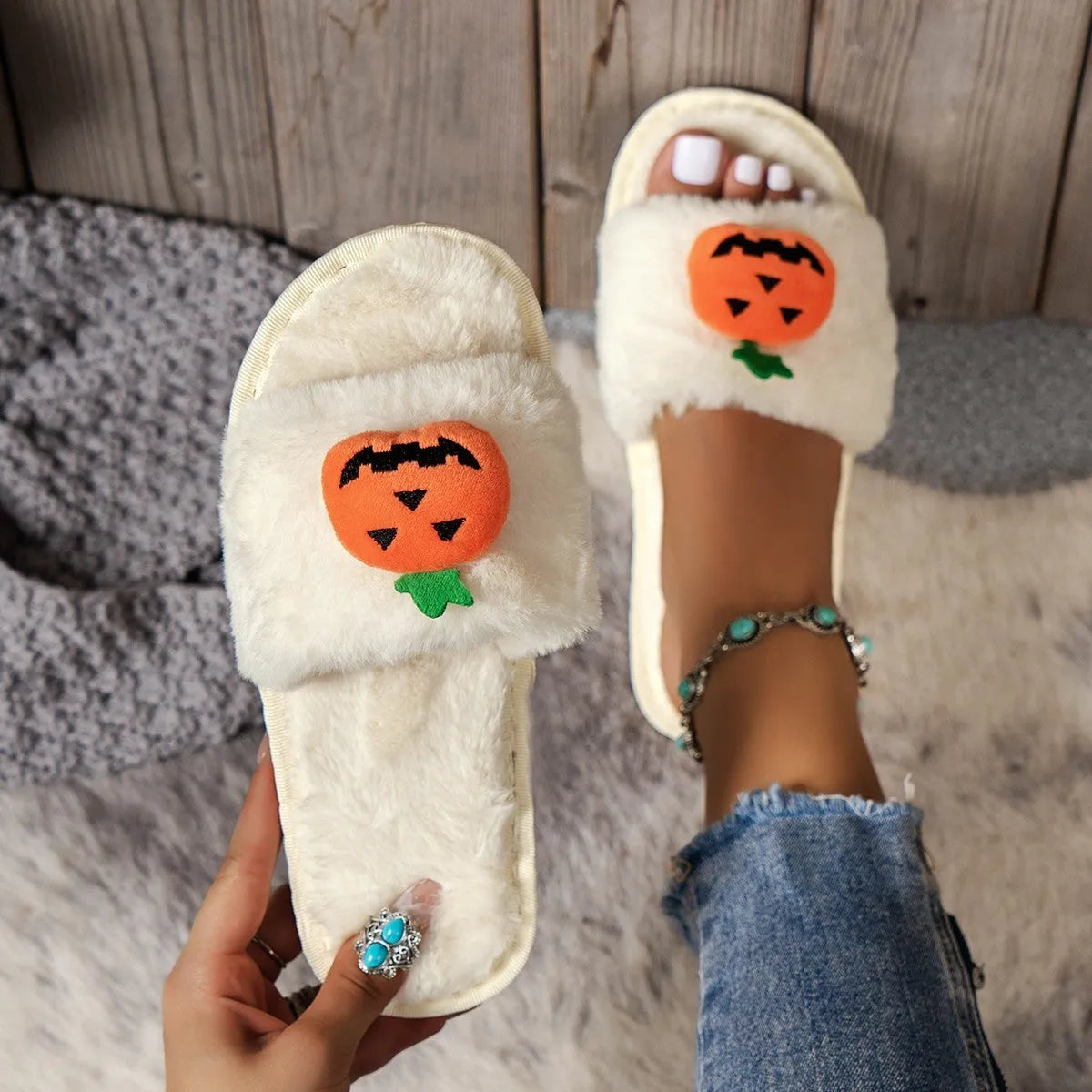 White and yellow Halloween pumpkin cartoon design open-toe plush slippers with synthetic fur.