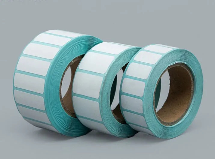 Roll of waterproof black and blue sticky sticker labels 20mm x 10mm 3000 sheets double row horizontal layout on table
