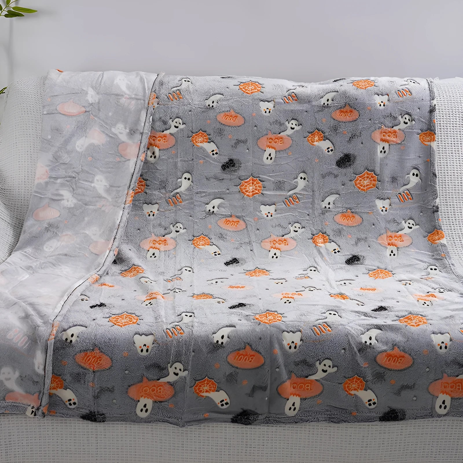 Cartoon style flannel child blanket shown covering an air conditioner, available in multiple colours.