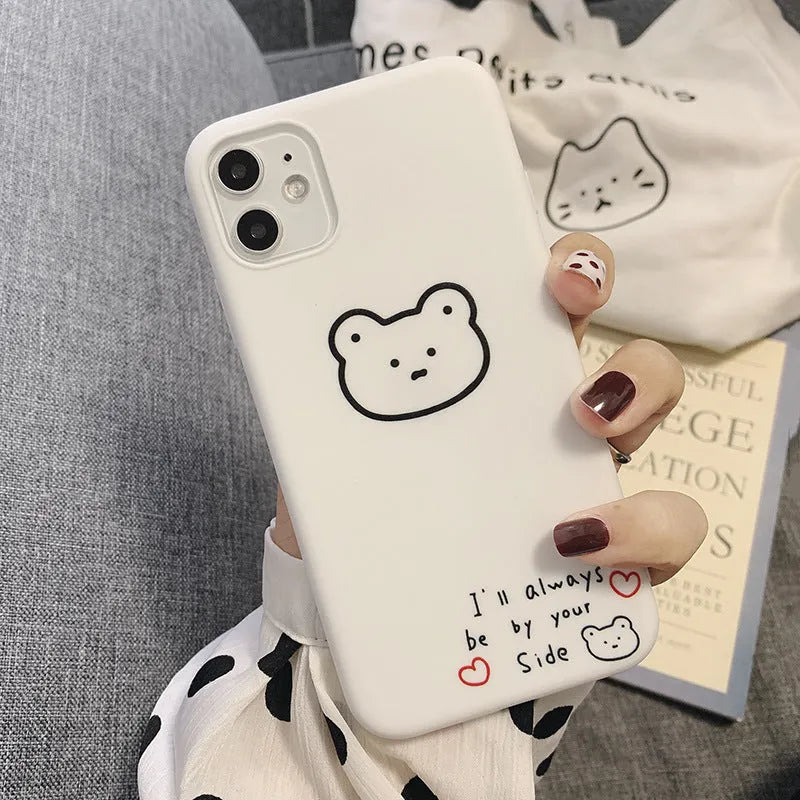 Soft silicone Apple iPhone case with a Korean bear cartoon design on the back.