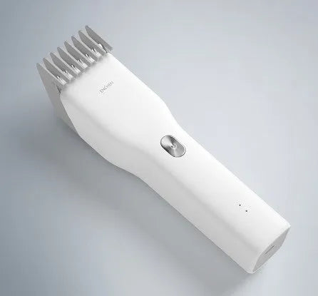 Black and white cordless electric hair clipper with ceramic cutter head and adjustable comb.