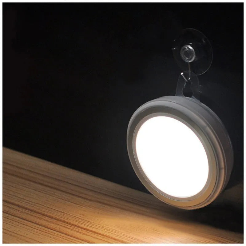 Circular motion sensor LED light unit showing front diffuser and compact 80mm diameter design