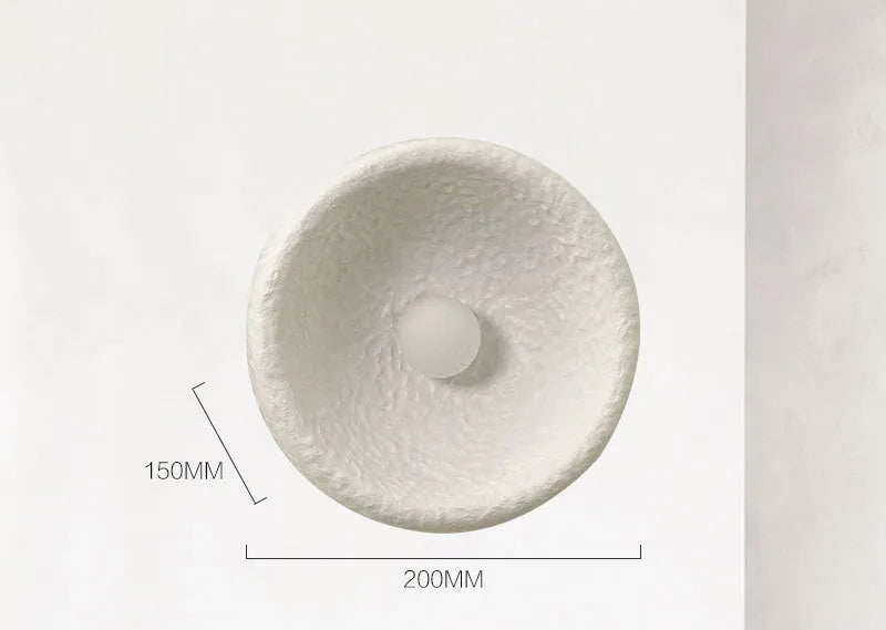 Japanese-style simple silent wall lamp with resin shade in warm white light.