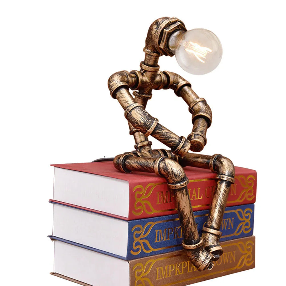 Vintage industrial robot table lamp with iron pipe design and water pipe light filtering