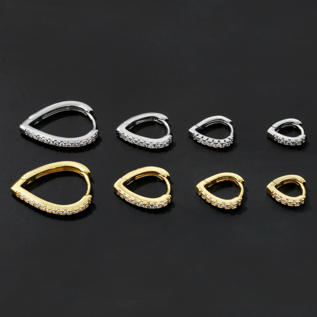 Copper geometric love heart ear clip with gold electroplating on white background
