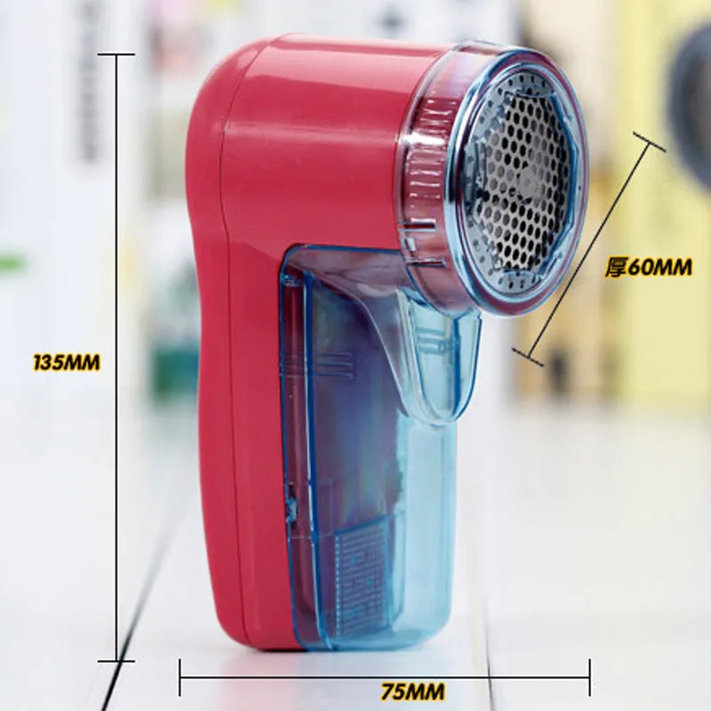 Blue portable electric lint remover for clothing, showing compact size next to a sweater.