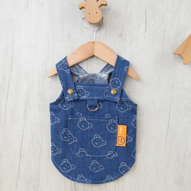 Small dog wearing denim princess dress with bracket skirt styling in blue denim fabric