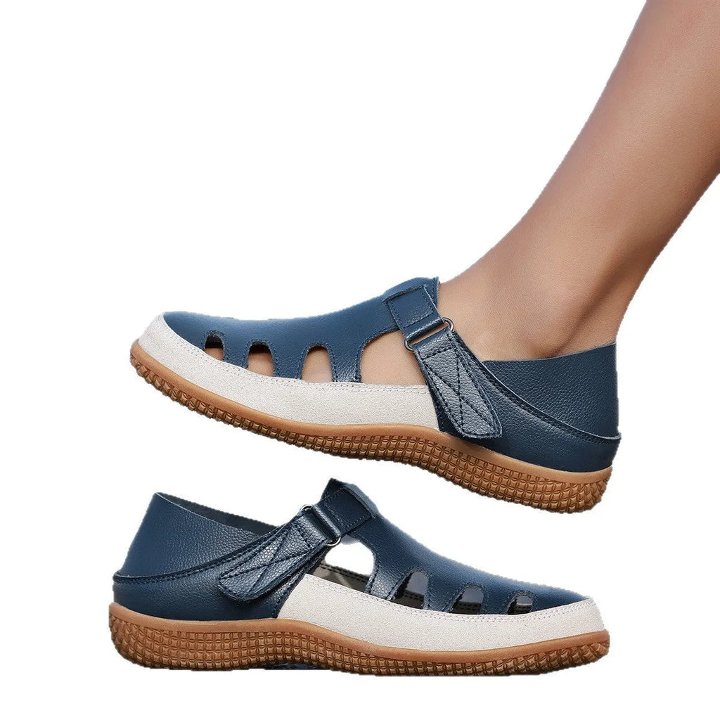 Women's plus size flat sandals in blue with hollow toe cap and breathable design on a thick rubber sole.