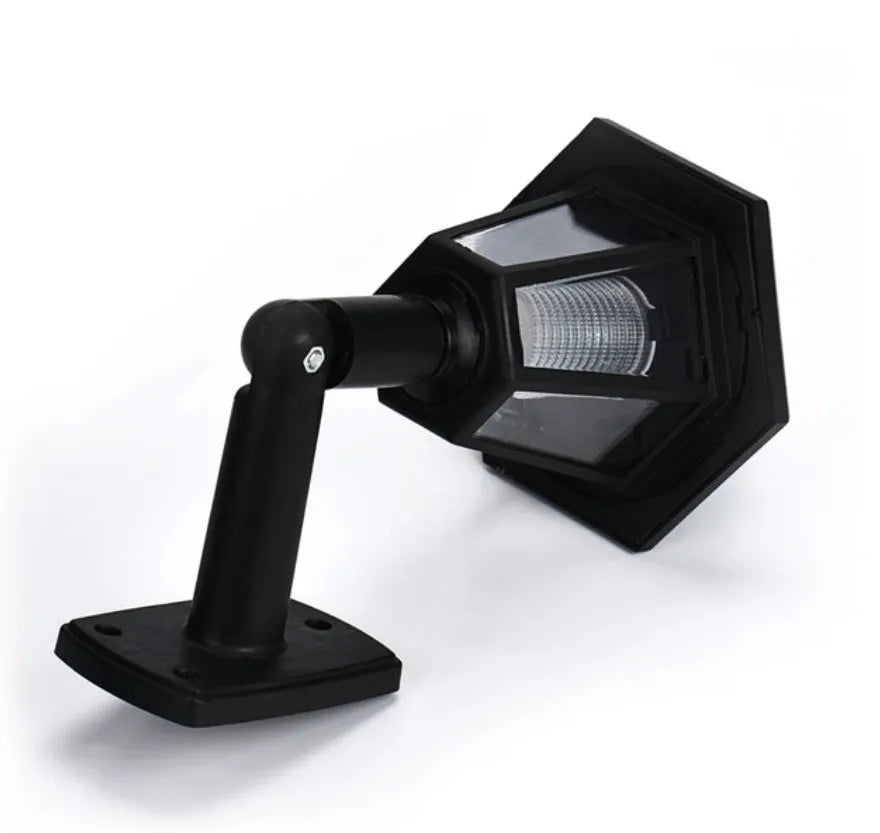 Black hexagonal solar-powered wall lamp with IP44 waterproof rating for outdoor garden lighting