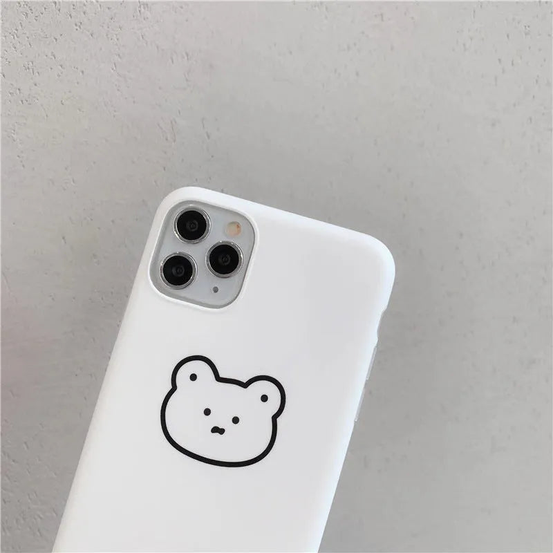 Soft silicone Apple iPhone case with a Korean bear cartoon design on the back.