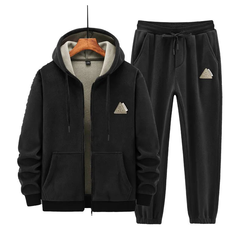 Casual grey sports suit set with a hooded cashmere-feel sweater and matching cotton-look pants on a hanger.