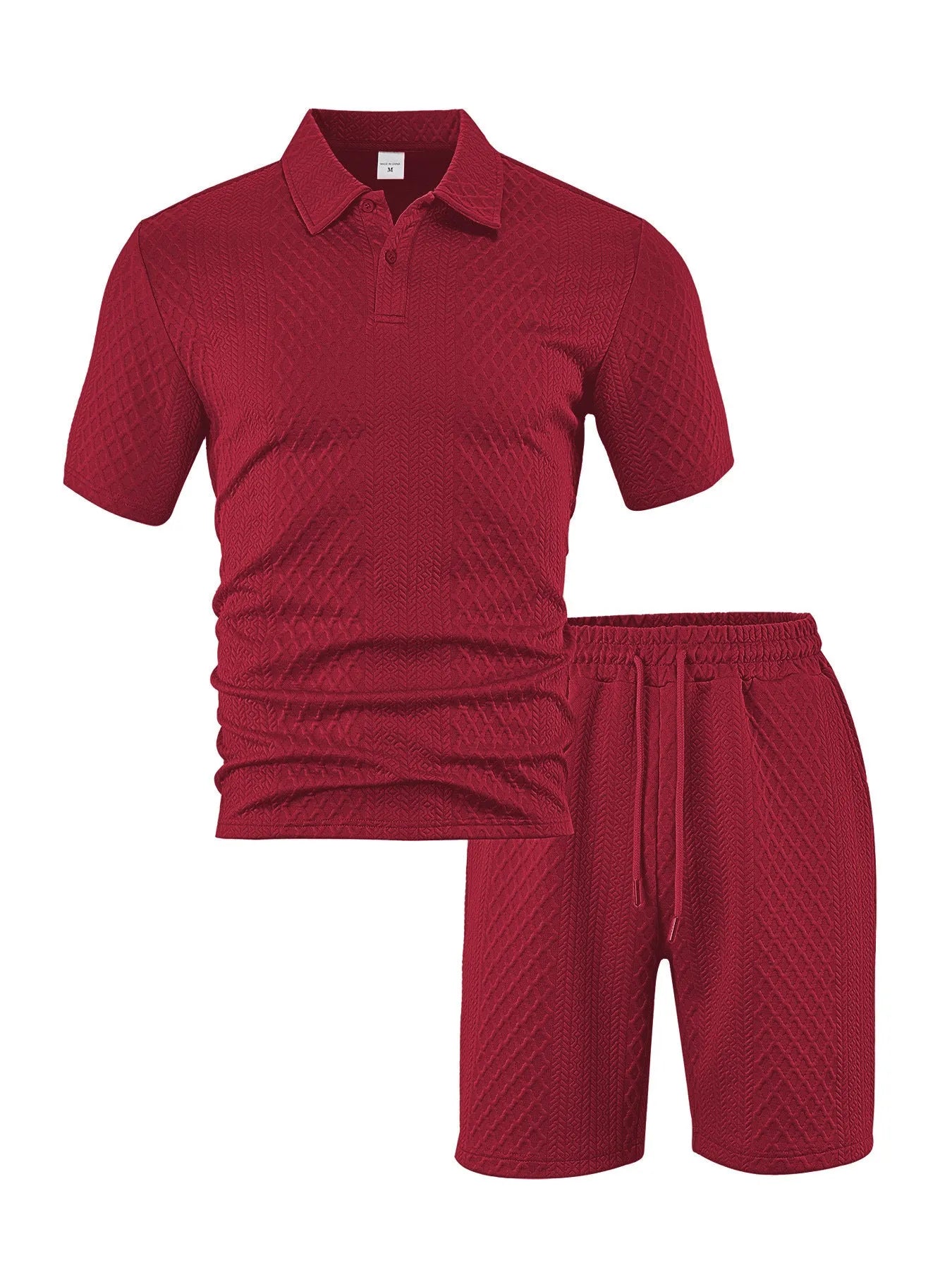 Men's patterned cloth casual suit comprising a short sleeve polo shirt and trousers on a hanger.