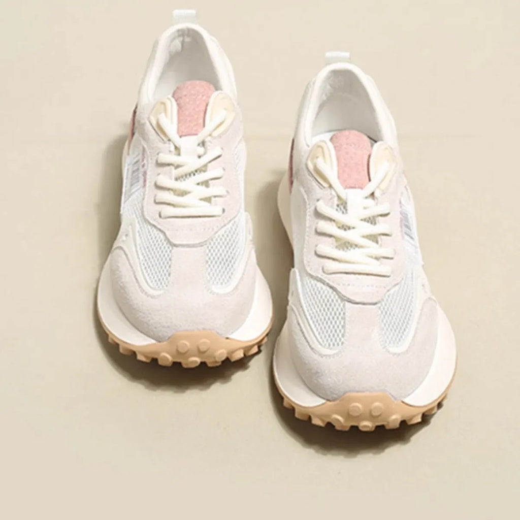 Women's grey retro sneaker with low-top design, mesh lining, and rubber sole