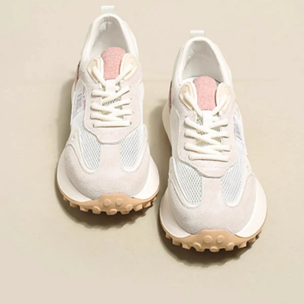 Women's grey retro sneaker with low-top design, mesh lining, and rubber sole