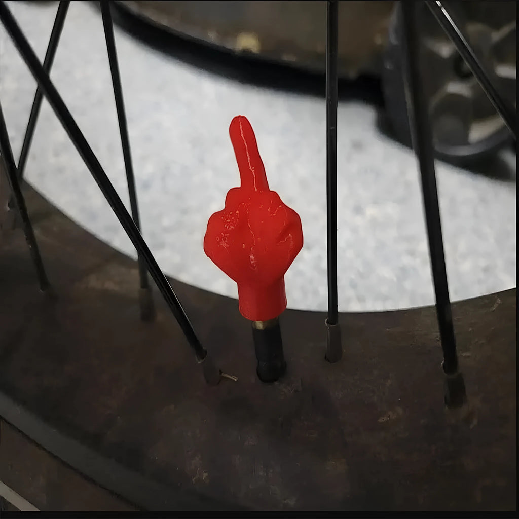 Eight car tyre valve dust caps showing four black and four skin colour latex pieces