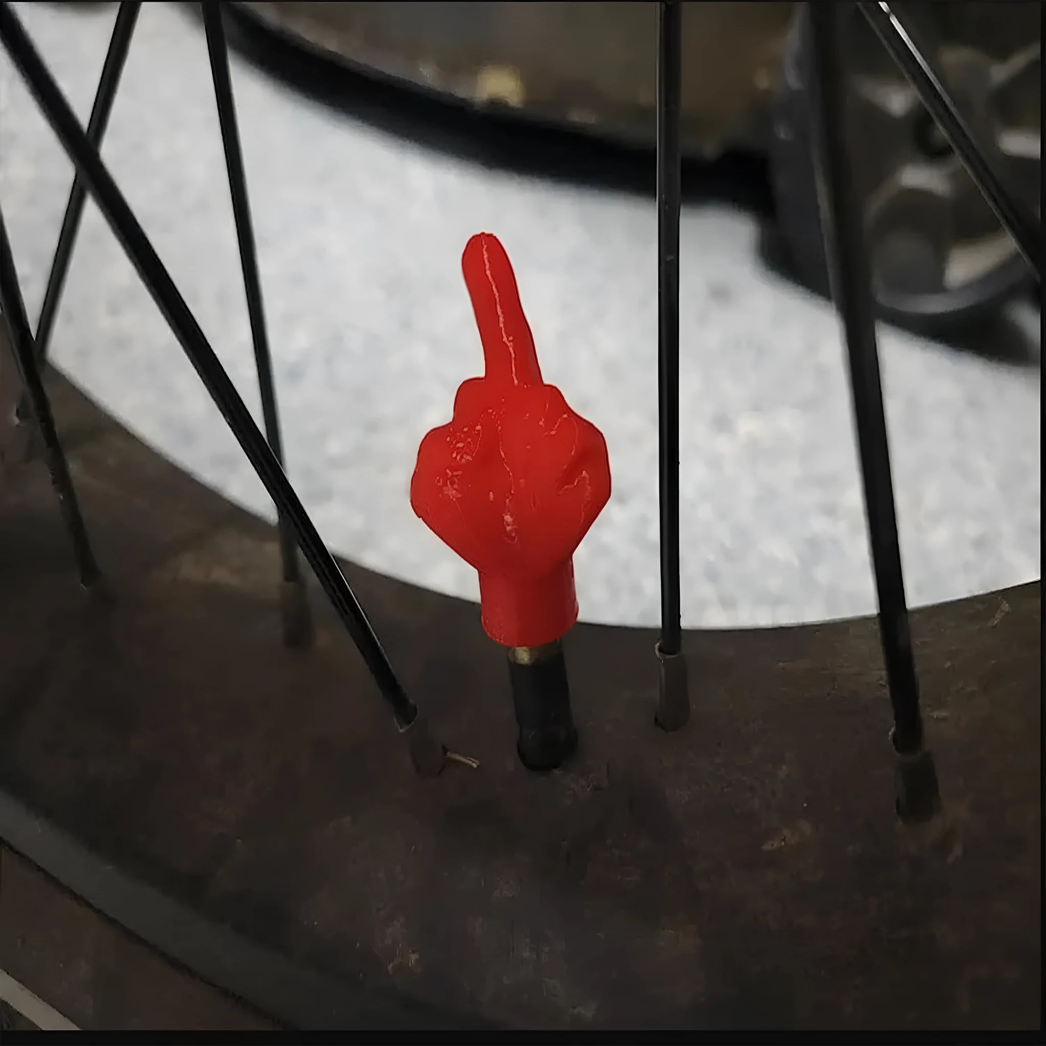 Eight car tyre valve dust caps showing four black and four skin colour latex pieces