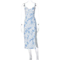 Women's long dress with lace flowers print, slit detail, and suspender straps in solid colour