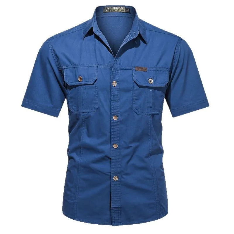 Men's army green cotton work shirt with short sleeves and a loose, non-iron fit.