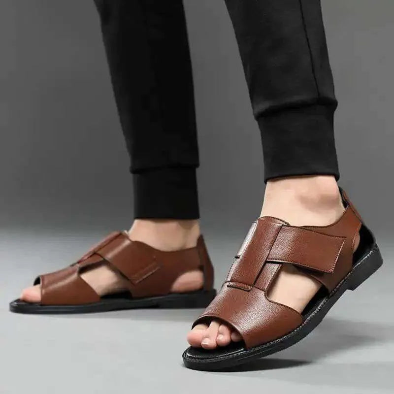 Men's black leather Roman sandals with an open toe and rubber sole on a white background.