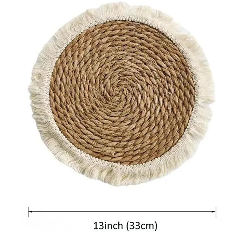 Round natural papyrus placemat with decorative tassels on a wooden table, shown in various sizes.