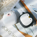 Cartoon penguin and polar bear USB rechargeable hand warmers showing front design