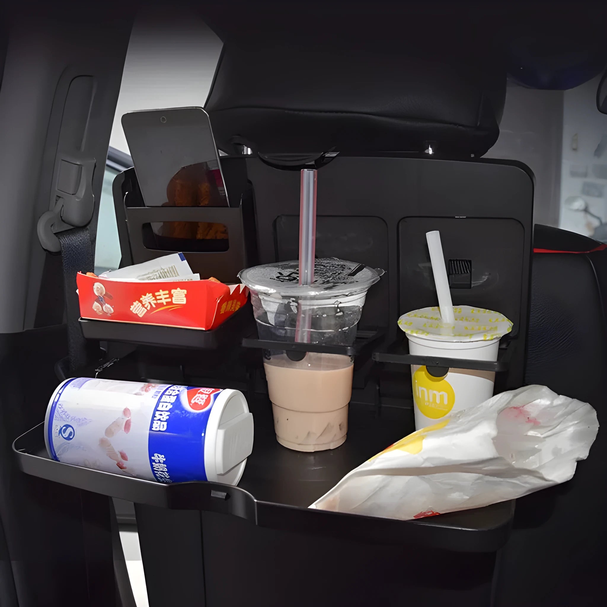 Car back seat folding table in black PP plastic with dimensions 340x200x30mm for holding drinks and phone