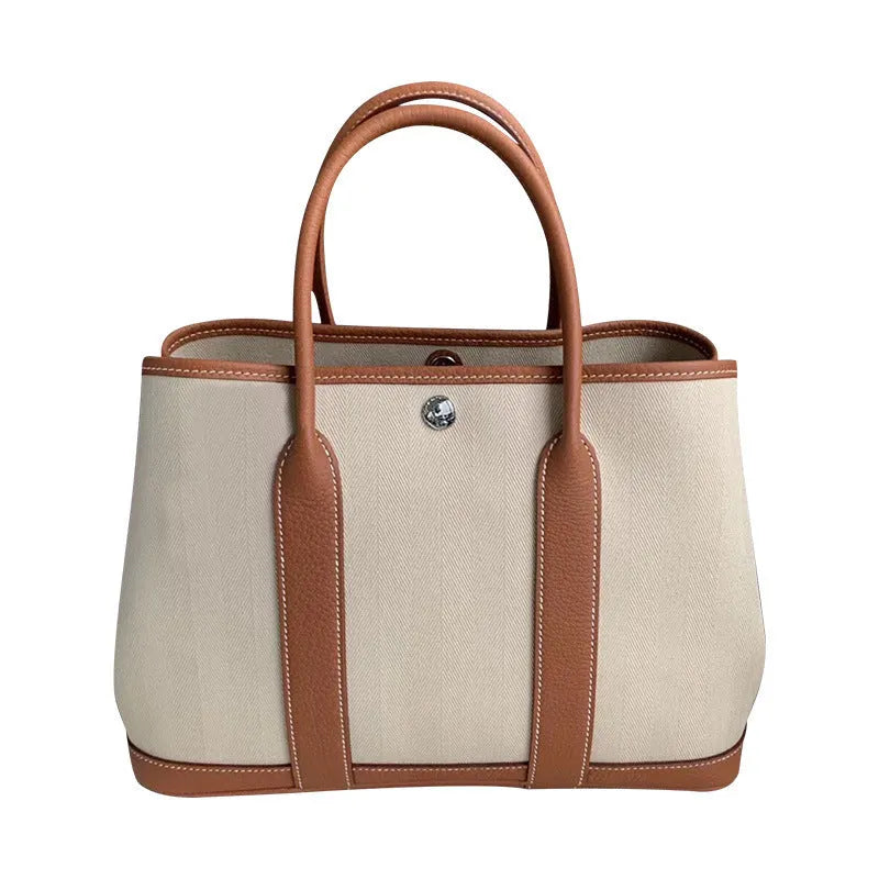 Genuine leather women's crossbody tote bag with canvas lining in bucket shape