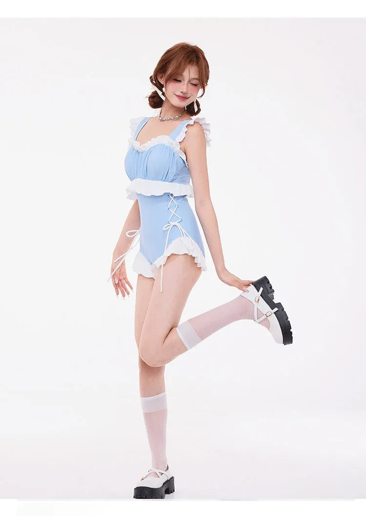 Light blue women's one-piece swimsuit with lace detail, high waist, and backless design on a mannequin