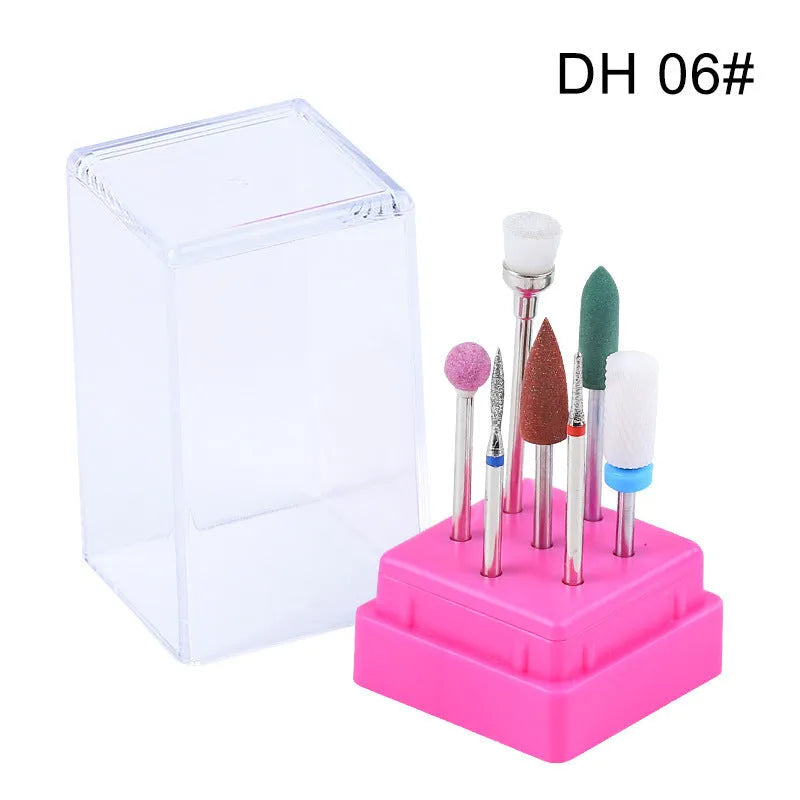 Tungsten steel nail art drill bit set with six bits, one brush, in a clear case.