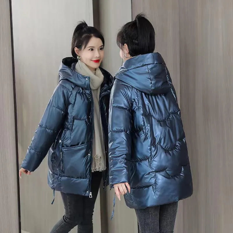 A women's loose-fit hooded winter jacket in a thick padded design, shown in one of four colour options.