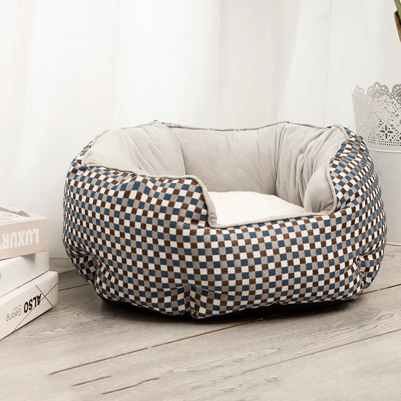 Blue octagonal pet sofa bed with a removable central mat for a small dog or cat.