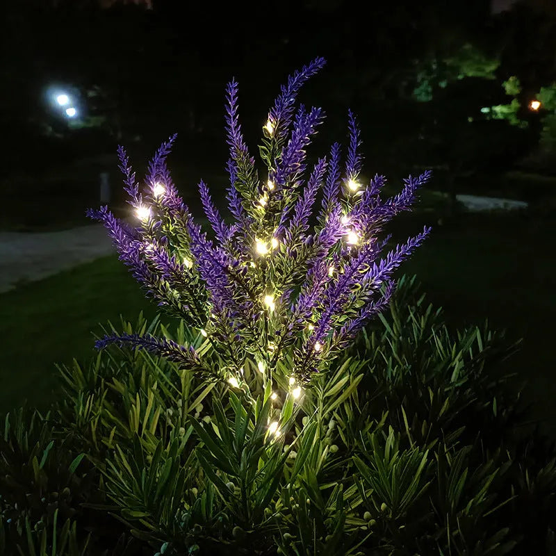A pink flower-shaped solar LED garden light standing 74 cm tall in an outdoor setting.