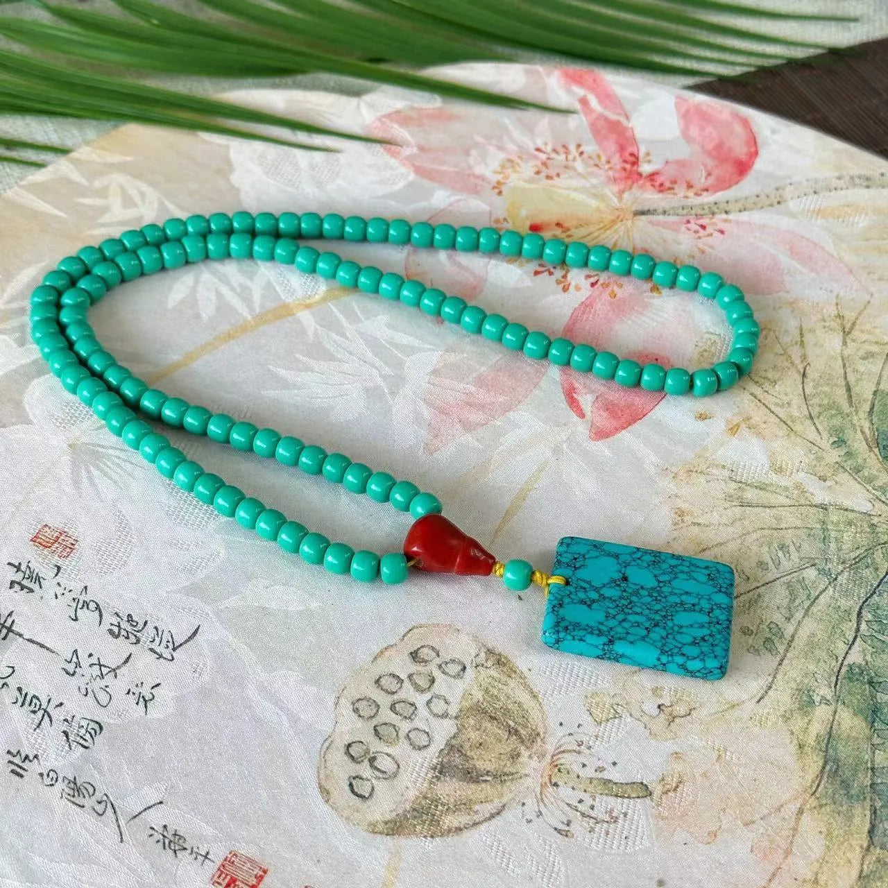 Turquoise mesh flower pendant necklace on adjustable ball bead chain
