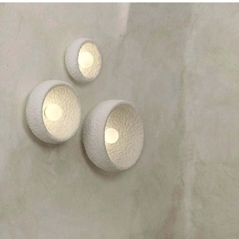 Japanese-style simple silent wall lamp with resin shade in warm white light.