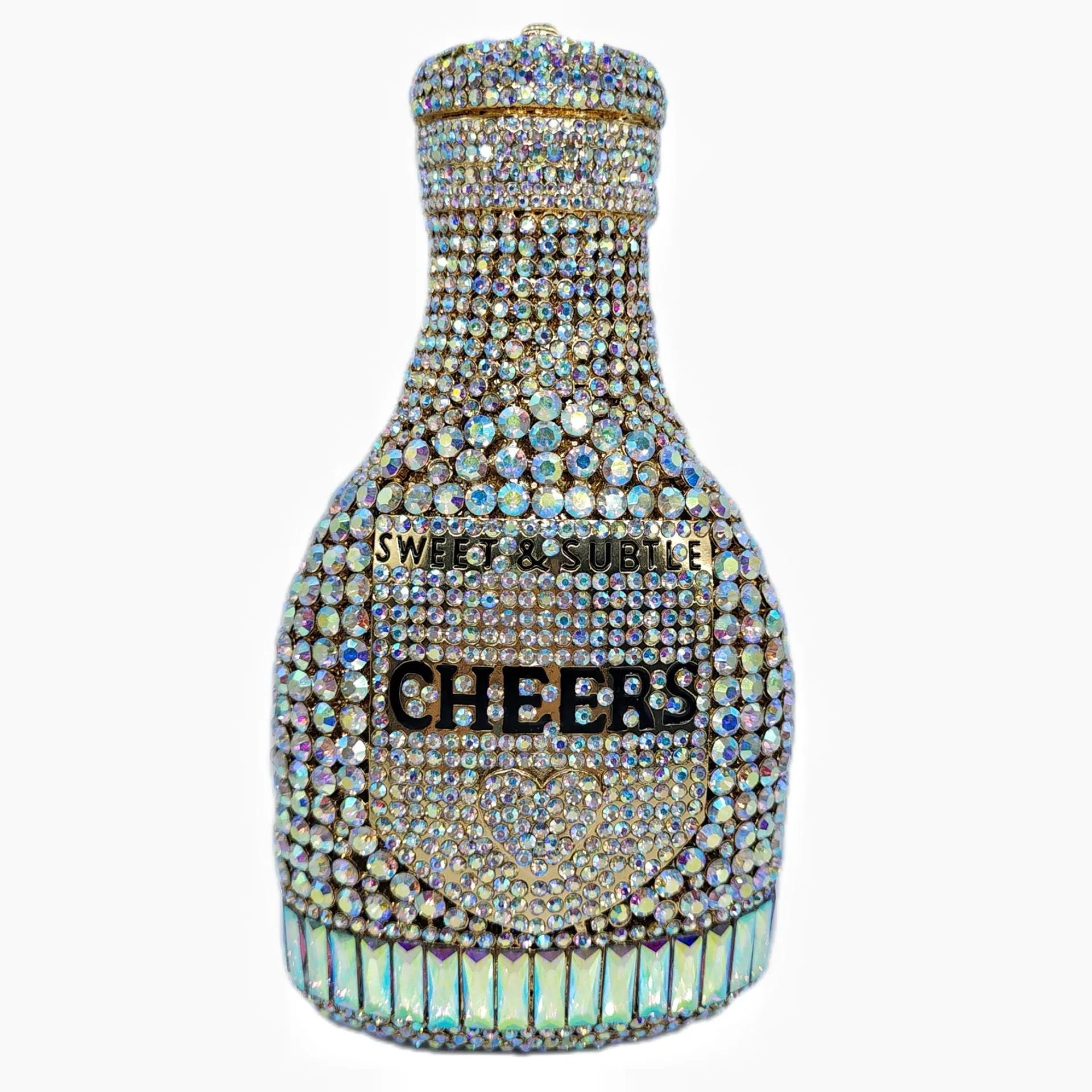 Gold hard-shell champagne bottle shaped evening clutch with rhinestones on a table.