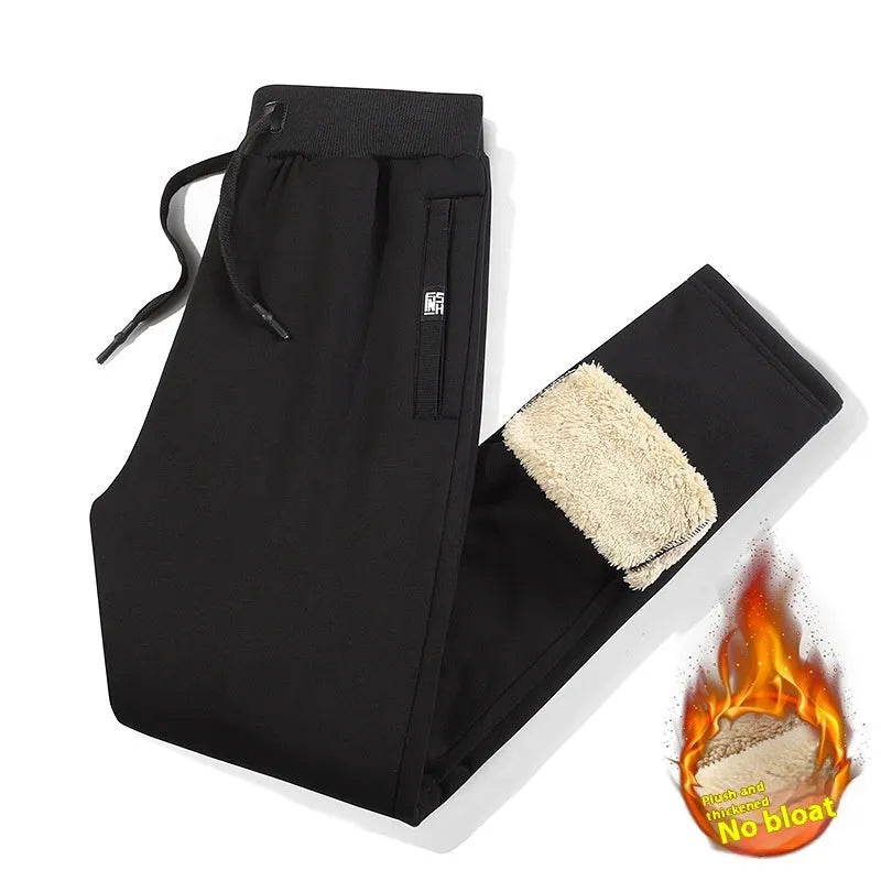 Men's grey fleece-lined oversized cotton track pants on a hanger.