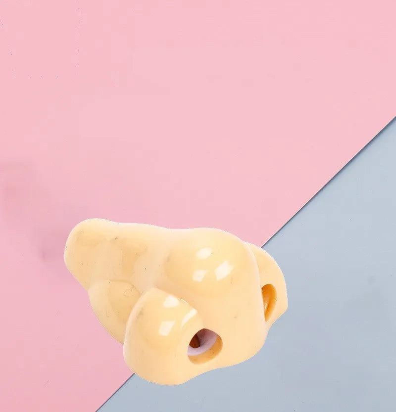 Flesh colour geometry-shaped plastic pencil sharpener with big nostril.