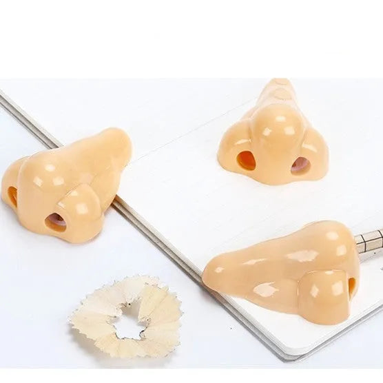 Flesh colour geometry-shaped plastic pencil sharpener with big nostril.