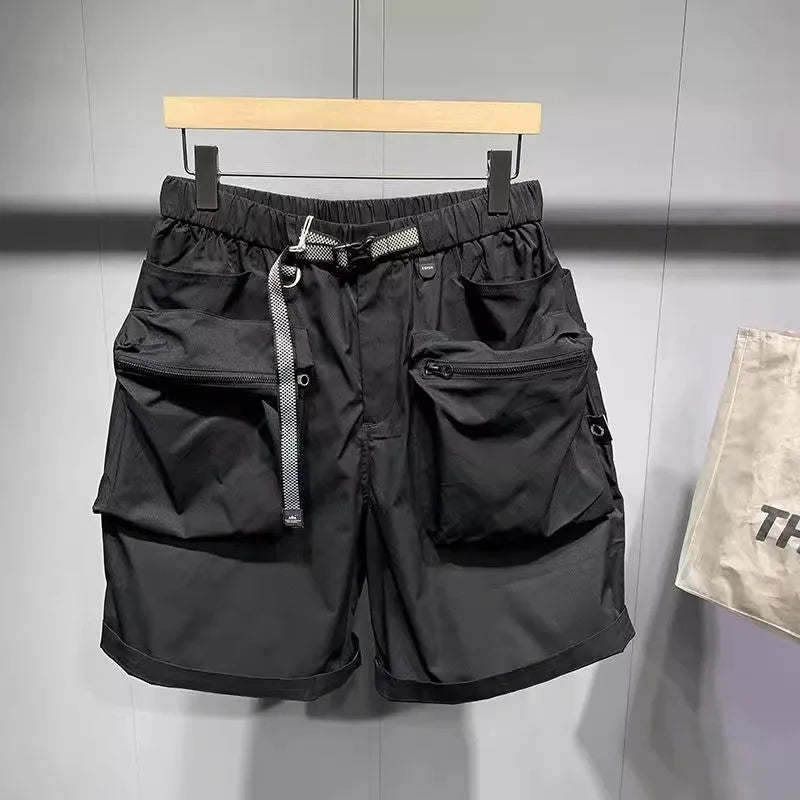 Men's black loose-fit cargo work shorts on a mannequin, showing multiple pockets and above-knee length.