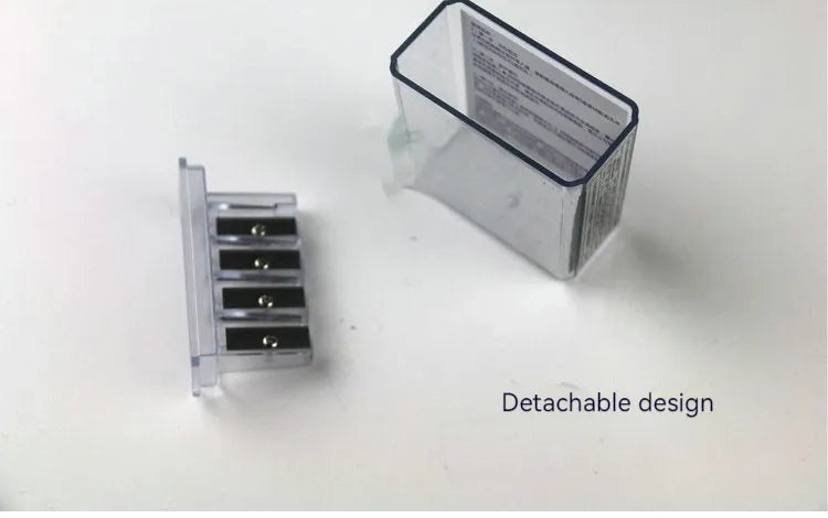 Four-hole plastic pencil sharpener with geometric design and screwdriver for blade replacement