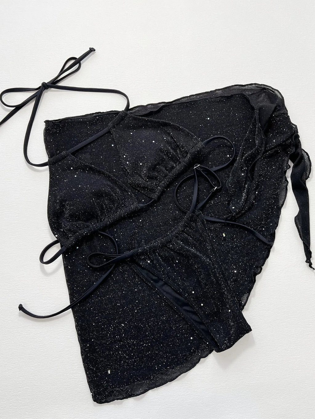 Black women's three-piece bikini swimsuit set with top and shorts.