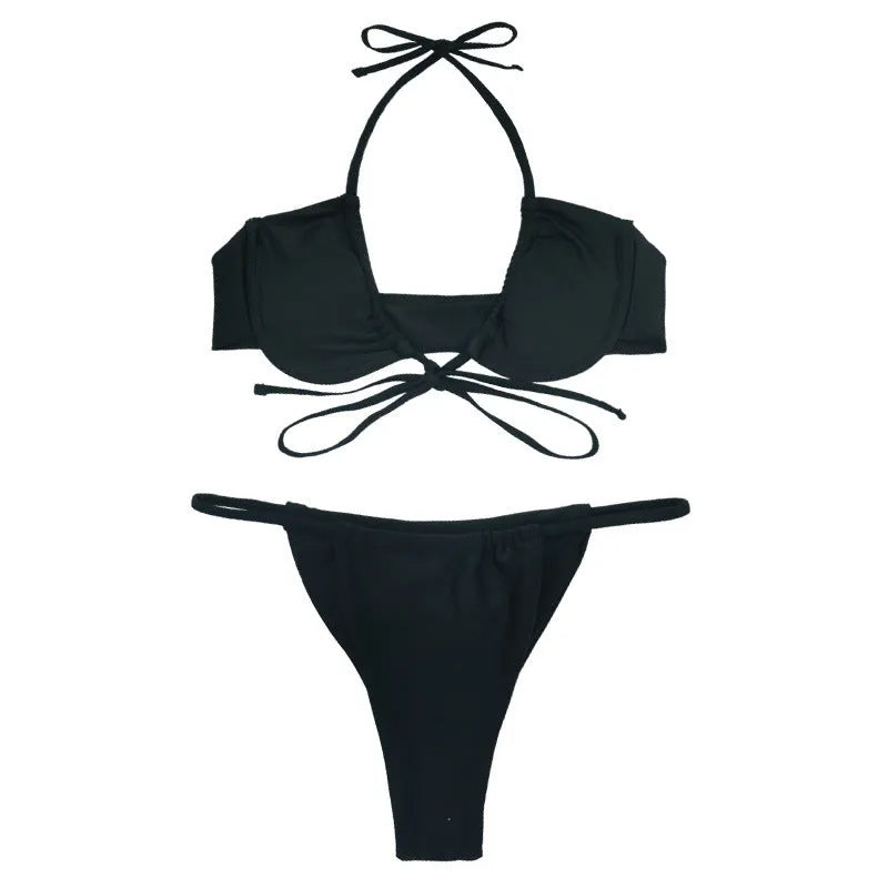 Women's black and mint green split bikini swimsuit on a hanger