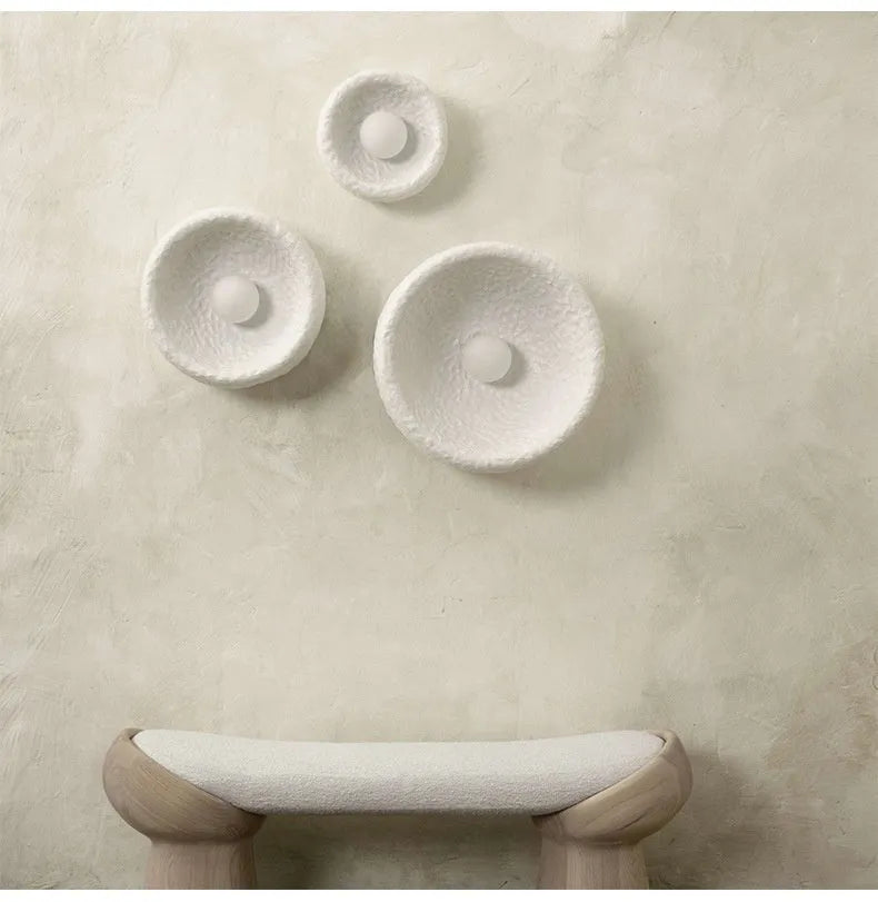 Japanese-style simple silent wall lamp with resin shade in warm white light.